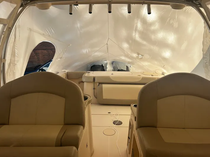  Yacht Photos Pics Interior of a 2011 Grady-White 307 boat with beige seating.