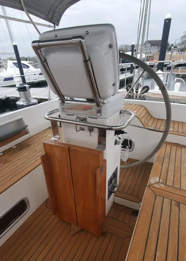 Tapestry Yacht Photos Pics Cockpit of 1989 Tayana 55 sailboat with wooden deck and steering wheel.