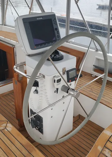 Tapestry Yacht Photos Pics Steering wheel and navigation system on a 1989 Tayana 55 yacht.