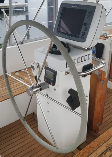 Tapestry Yacht Photos Pics Steering wheel and navigation equipment on 1989 Tayana 55 sailboat.