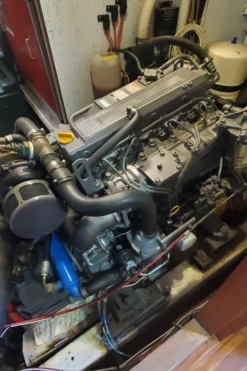 Tapestry Yacht Photos Pics Engine of a 1989 Tayana 55 sailboat, showcasing detailed mechanical components.