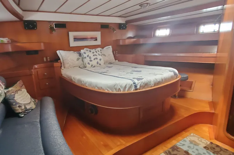 Tapestry Yacht Photos Pics Luxurious 1989 Tayana 55 yacht cabin with wooden interior and cozy bed.