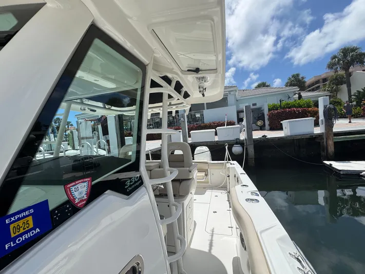  Yacht Photos Pics Boston Whaler 330 Outrage 2016 docked in sunny Florida marina.