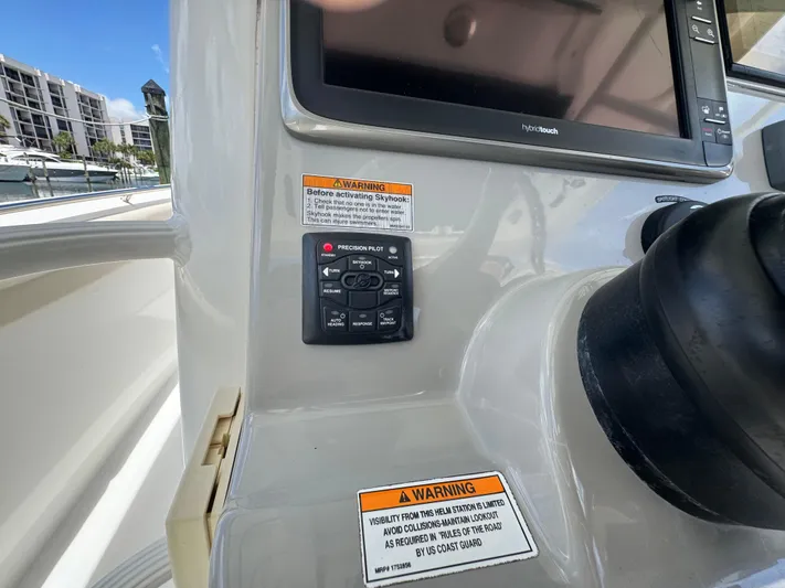  Yacht Photos Pics Control panel of a 2016 Boston Whaler 330 Outrage boat with warning labels.