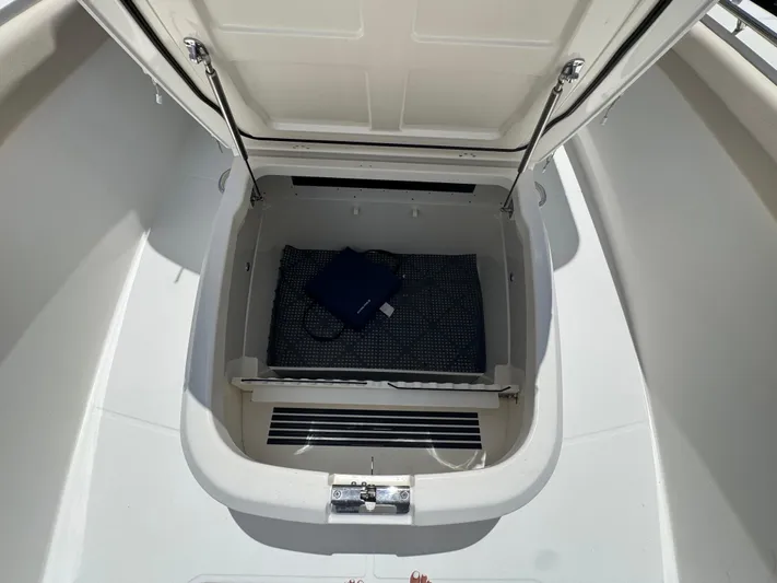  Yacht Photos Pics Open storage compartment on 2016 Boston Whaler 330 Outrage boat.