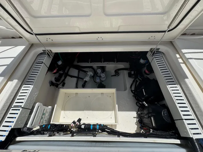  Yacht Photos Pics Open engine compartment of a 2016 Boston Whaler 330 Outrage boat, showing internal components.