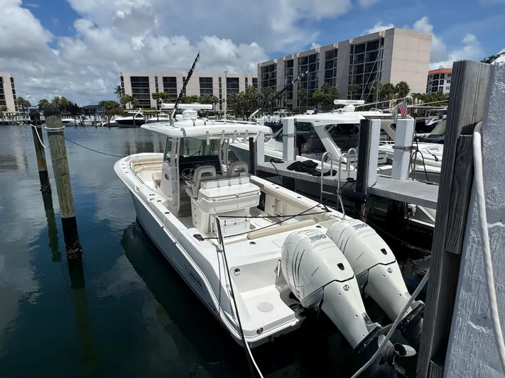  Yacht Photos Pics 2016 Boston Whaler 330 Outrage docked at marina with twin engines.