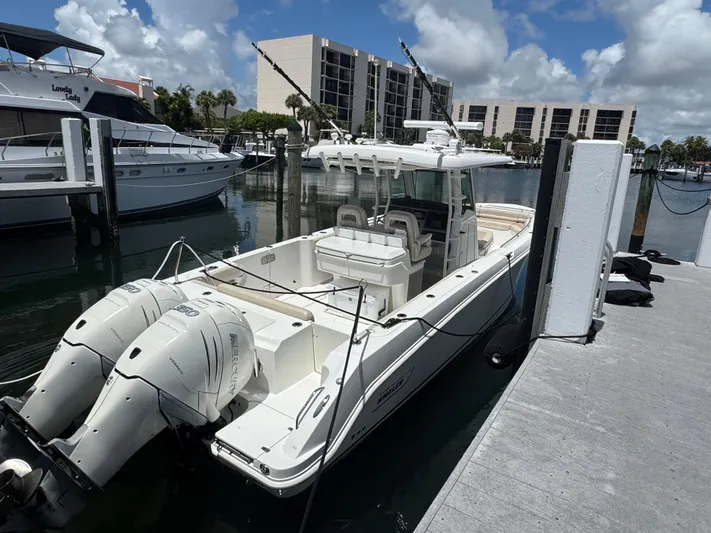  Yacht Photos Pics 2016 Boston Whaler 330 Outrage docked at marina with twin Mercury engines.
