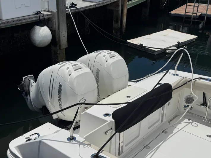  Yacht Photos Pics 2016 Boston Whaler 330 Outrage with twin Mercury outboard engines docked at marina.