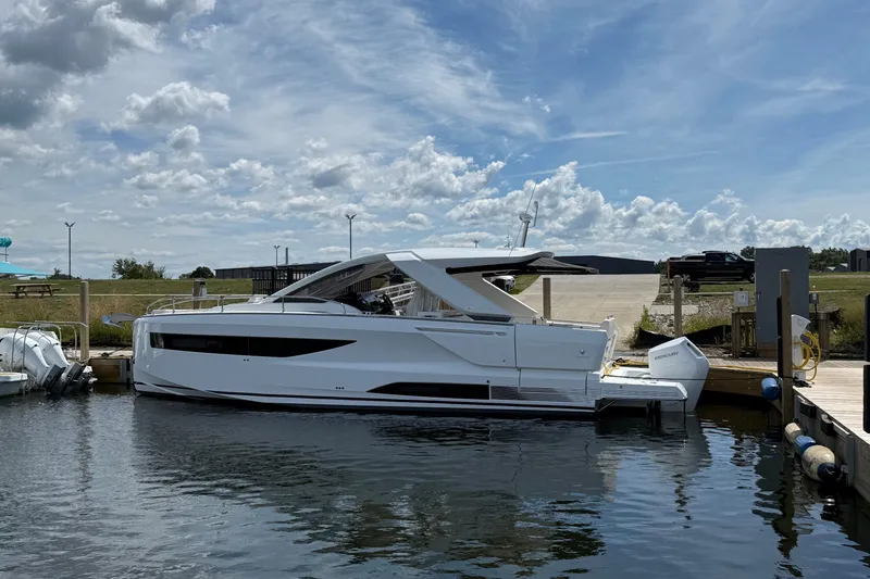  Yacht Photos Pics 2026 Jeanneau DB/37 OB yacht docked on a sunny day with blue skies.