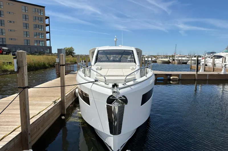  Yacht Photos Pics 2026 Jeanneau DB/37 OB yacht docked at marina under clear blue sky.