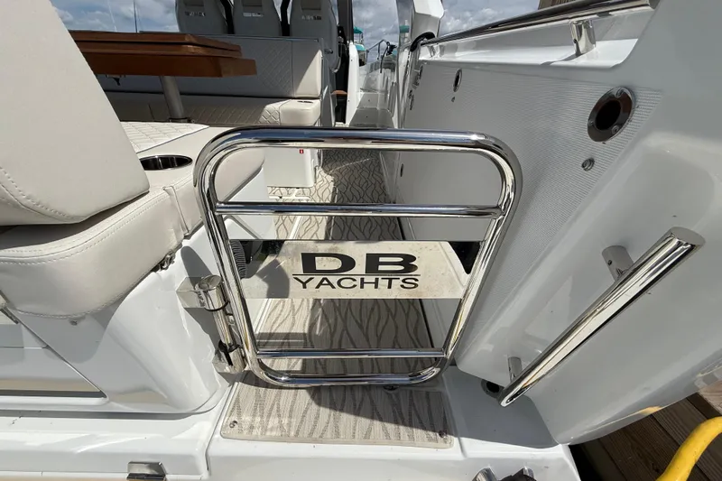 Yacht Photos Pics 2026 Jeanneau DB/37 OB yacht interior with chrome gate and seating.