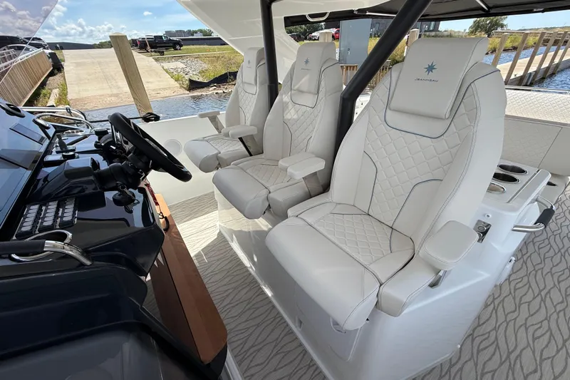  Yacht Photos Pics Luxury seating on 2026 Jeanneau DB/37 OB boat, featuring elegant white upholstery and modern design.