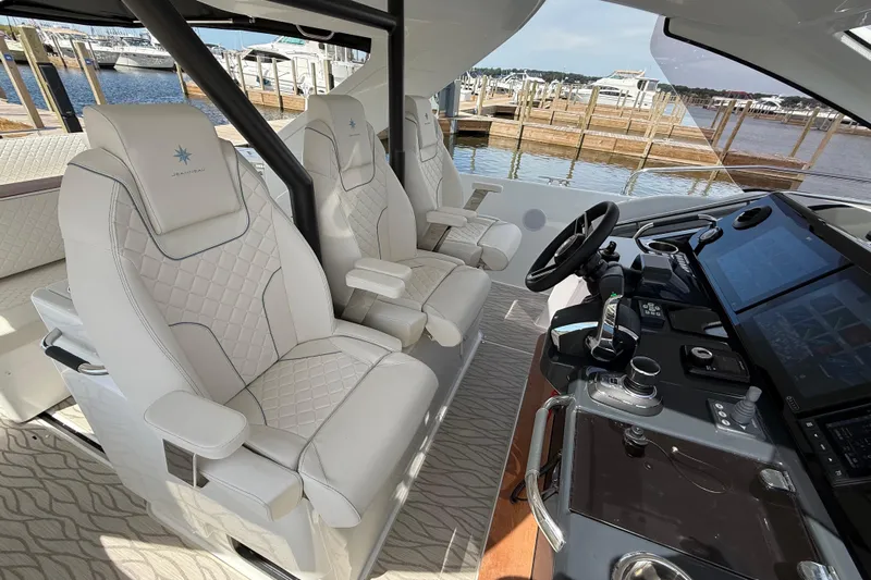  Yacht Photos Pics 2026 Jeanneau DB/37 OB boat interior with luxurious seating and modern dashboard controls.
