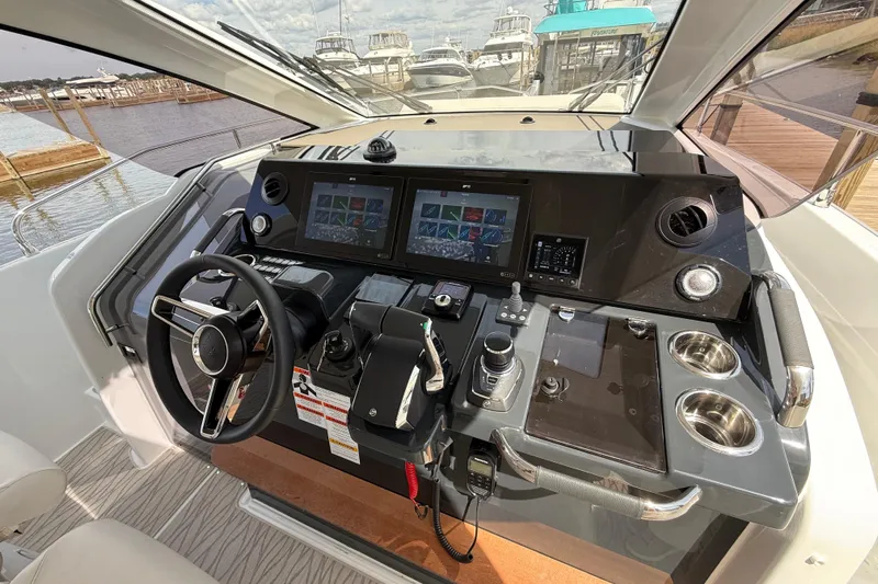  Yacht Photos Pics 2026 Jeanneau DB/37 OB boat cockpit with advanced navigation controls and dual screens.
