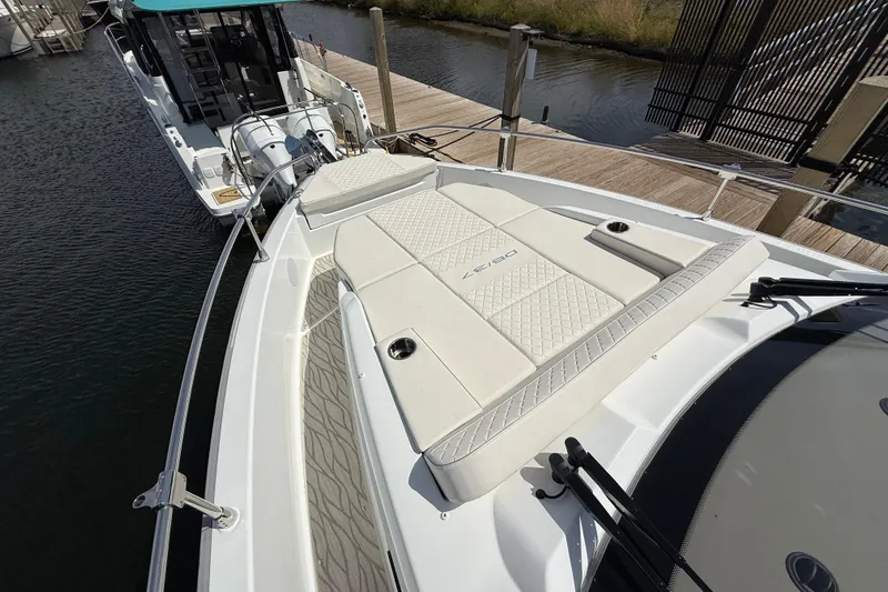  Yacht Photos Pics 2026 Jeanneau DB/37 OB boat with elegant deck design at a marina.