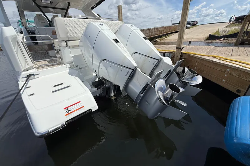  Yacht Photos Pics 2026 Jeanneau DB/37 OB boat with dual outboard engines docked at marina.
