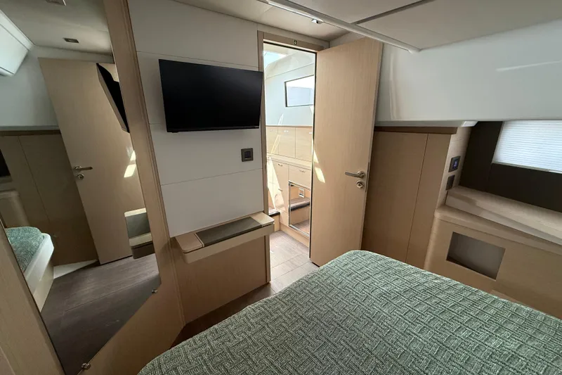  Yacht Photos Pics Interior of 2026 Jeanneau DB/37 OB yacht with modern design and cozy bedroom.