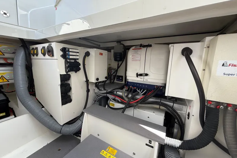  Yacht Photos Pics Engine compartment of 2026 Jeanneau DB/37 OB boat, showcasing electrical systems and wiring.