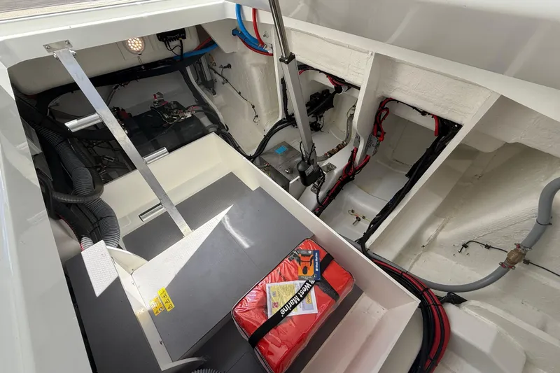  Yacht Photos Pics 2026 Jeanneau DB/37 OB boat interior showing engine compartment and wiring.