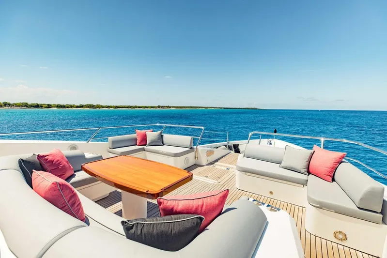 Tayrona Yacht Photos Pics Luxurious Sunseeker 131 Yacht deck with elegant seating, ocean view, and clear blue sky.