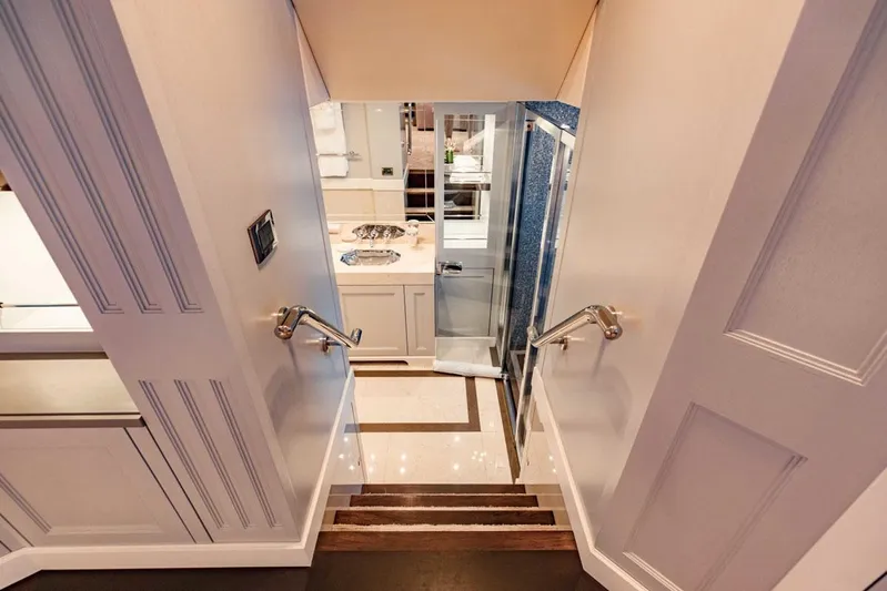 Tayrona Yacht Photos Pics Staircase leading to luxurious kitchen on 2012 Sunseeker 131 Yacht.