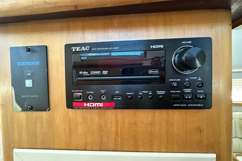 Alyce's Palace II Yacht Photos Pics TEAC DVD receiver and remote switch in 1995 Carver 440 Aft Cabin Motor Yacht.
