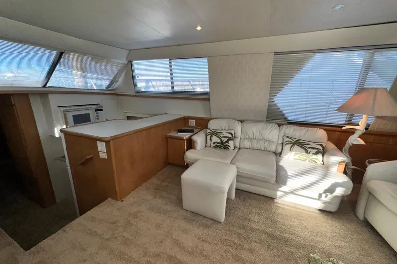 Alyce's Palace II Yacht Photos Pics Interior of 1995 Carver 440 Aft Cabin Motor Yacht with white sofa and natural light.