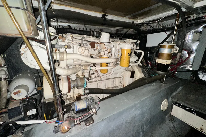 Alyce's Palace II Yacht Photos Pics Engine room of a 1995 Carver 440 Aft Cabin Motor Yacht, showcasing mechanical components.
