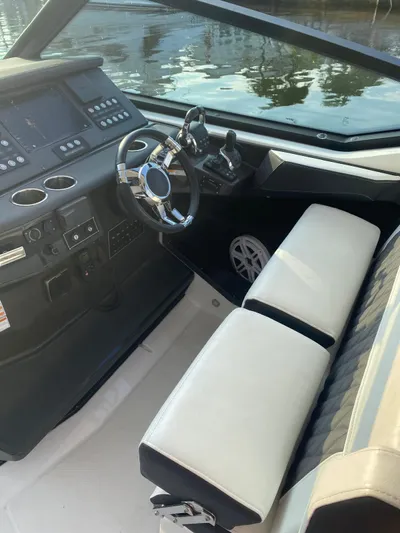  Yacht Photos Pics 2019 Monterey 378 boat interior with modern dashboard and white seating.