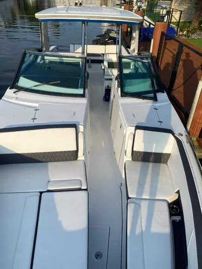  Yacht Photos Pics 2019 Monterey 378 boat with spacious seating and sleek design docked by the water.