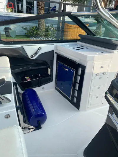  Yacht Photos Pics 2019 Monterey 378 boat interior with seating, storage, and blue fender.