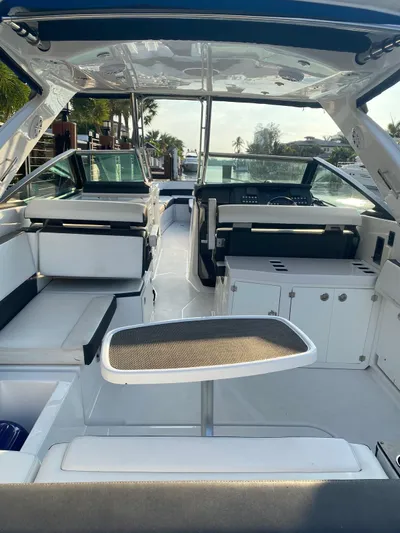  Yacht Photos Pics 2019 Monterey 378 boat interior with seating, table, and helm.