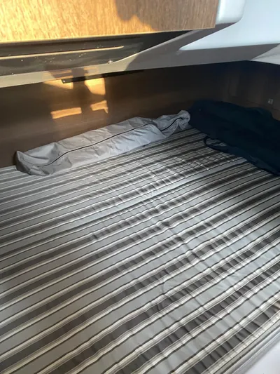  Yacht Photos Pics 2019 Monterey 378 cabin with striped bedding and wooden accents.