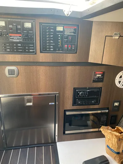  Yacht Photos Pics Control panel and appliances inside a 2019 Monterey 378 boat cabin.