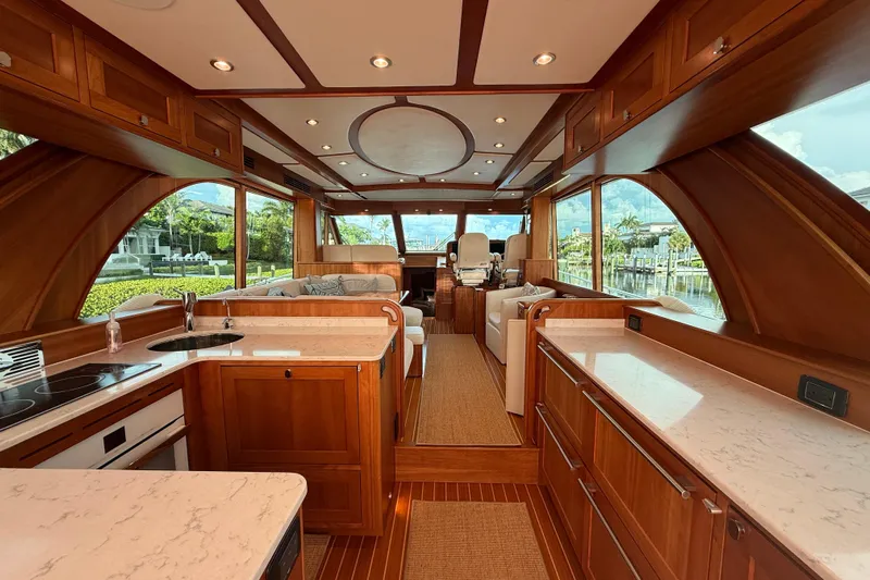  Yacht Photos Pics Luxurious interior of 2021 Sabre 58 Salon Express yacht with elegant wood finishes.