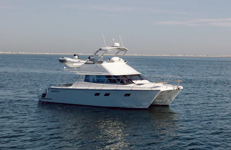  Yacht Photos Pics 2025 ArrowCat 420 Flybridge yacht cruising on open water.