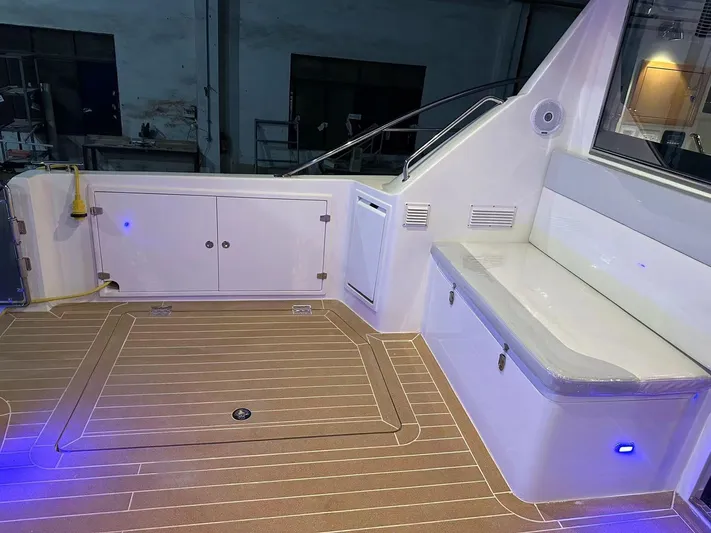  Yacht Photos Pics 2025 ArrowCat 420 Flybridge interior with seating and storage, featuring modern lighting.