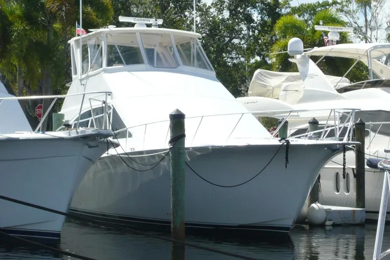 Bella Donna Yacht Photos Pics 1999 Ocean Yachts 56 docked, featuring sleek white design and Garmin equipment.