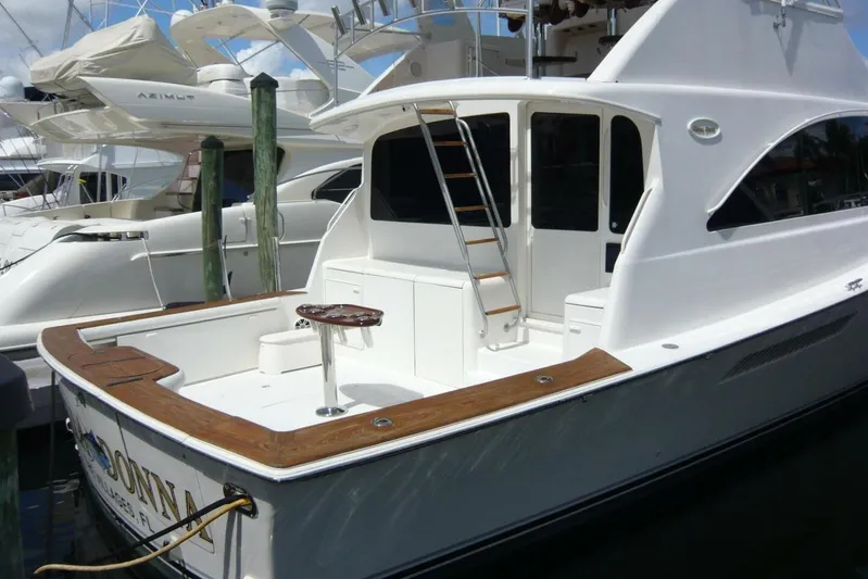 Bella Donna Yacht Photos Pics 1999 Ocean Yachts 56 docked, featuring a spacious deck and sleek design.