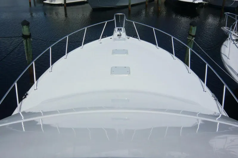 Bella Donna Yacht Photos Pics Bow view of 1999 Ocean Yachts 56 model, docked in a marina.