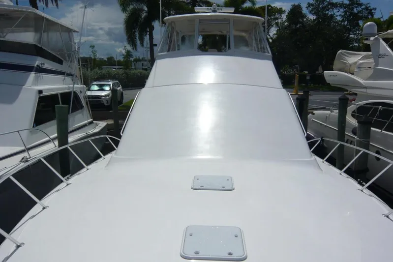 Bella Donna Yacht Photos Pics 1999 Ocean Yachts 56 boat docked, showcasing sleek white deck and cabin.