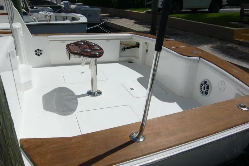 Bella Donna Yacht Photos Pics 1999 Ocean Yachts 56 cockpit with wooden trim and fishing rod holder.
