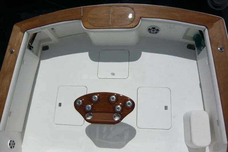 Bella Donna Yacht Photos Pics 1999 Ocean Yachts 56 cockpit with wooden accents and fishing rod holders.