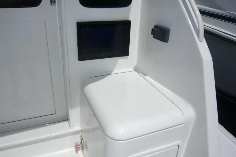 Bella Donna Yacht Photos Pics 1999 Ocean Yachts 56 interior detail with white seating and control panel.