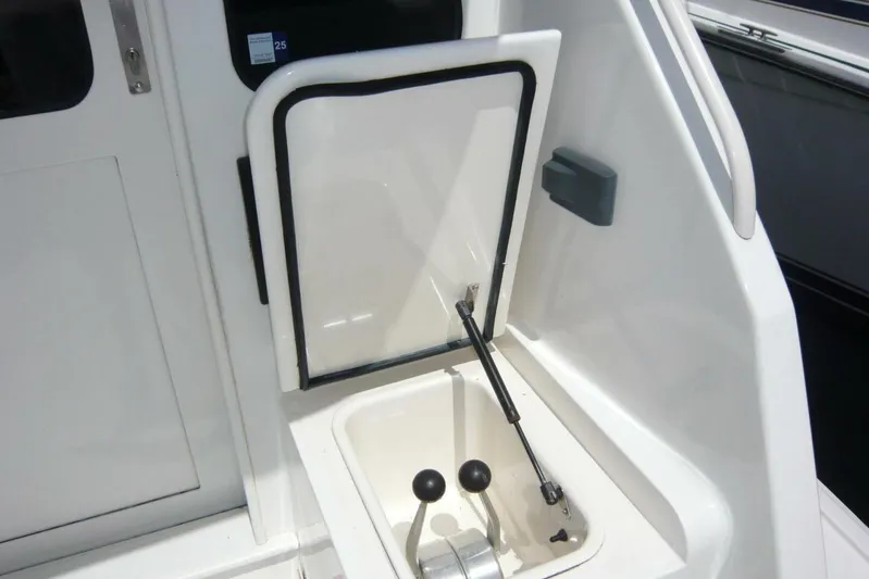 Bella Donna Yacht Photos Pics Control panel on a 1999 Ocean Yachts 56, featuring levers and a hatch.