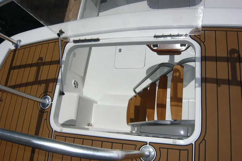 Bella Donna Yacht Photos Pics Hatch and wooden steps on 1999 Ocean Yachts 56 boat deck.