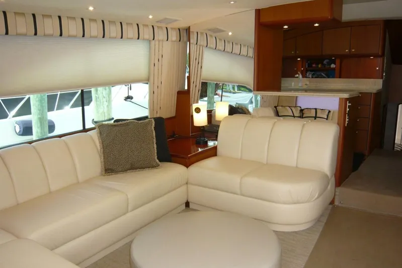 Bella Donna Yacht Photos Pics Luxurious interior of a 1999 Ocean Yachts 56, featuring elegant white seating and modern decor.