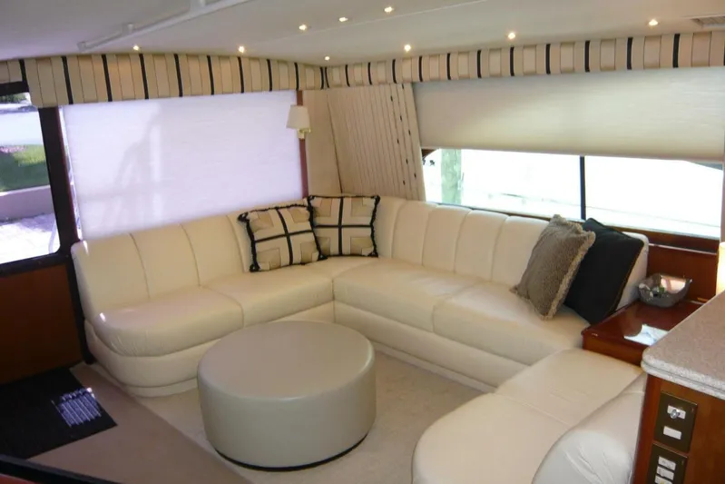Bella Donna Yacht Photos Pics Luxurious interior of 1999 Ocean Yachts 56 with white leather seating and modern decor.