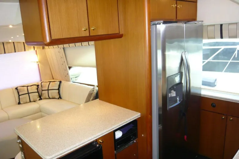 Bella Donna Yacht Photos Pics Luxurious interior of 1999 Ocean Yachts 56 with modern kitchen and cozy seating area.